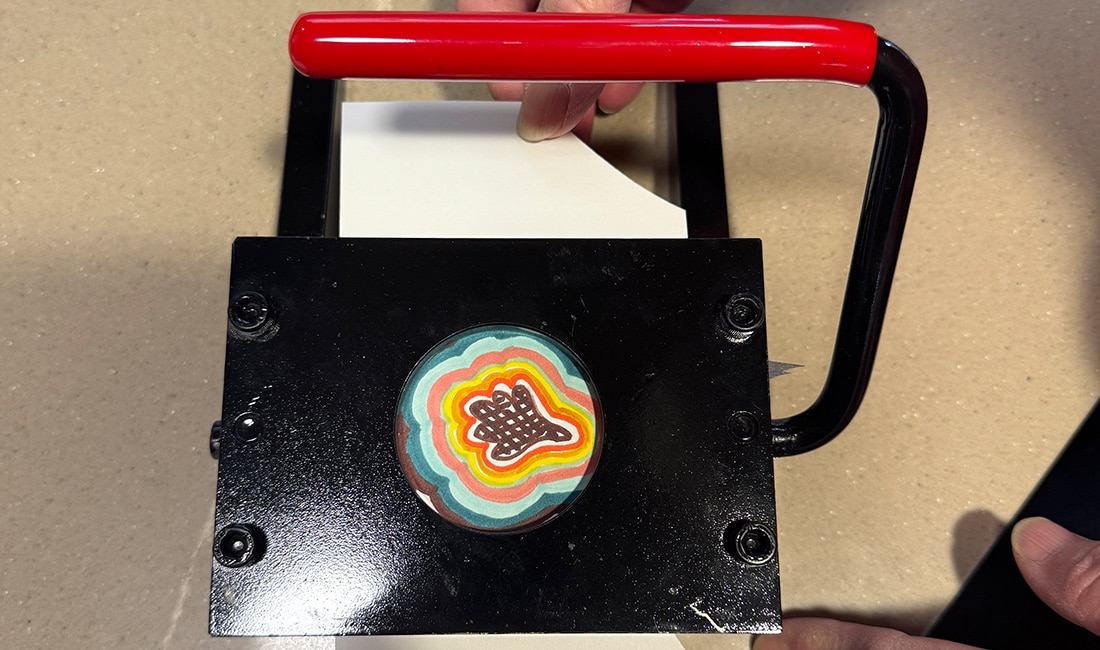 Step 2 of Button Making 101 is to cut out your design in a circle shape