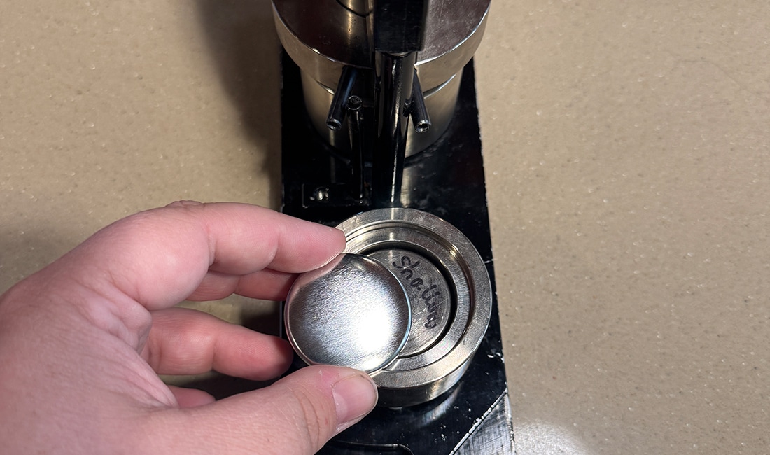 Step 3 in Button Making 101 is to place the button shell in the shallow end of the button maker, rounded side up