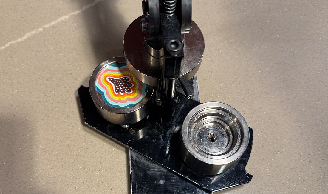 The first part of Step 5 in Button Making 101 is to turn the mechanism