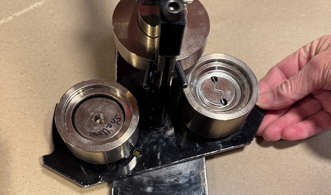 The first part of Step 7 in Button Making 101 is to turn the mechanism