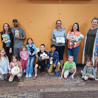 Families of all ages grouped together during Family Program time at the Hudson Public Library