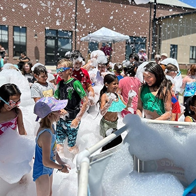 Foam fun for kids of all ages outside at the Hudson Public Library